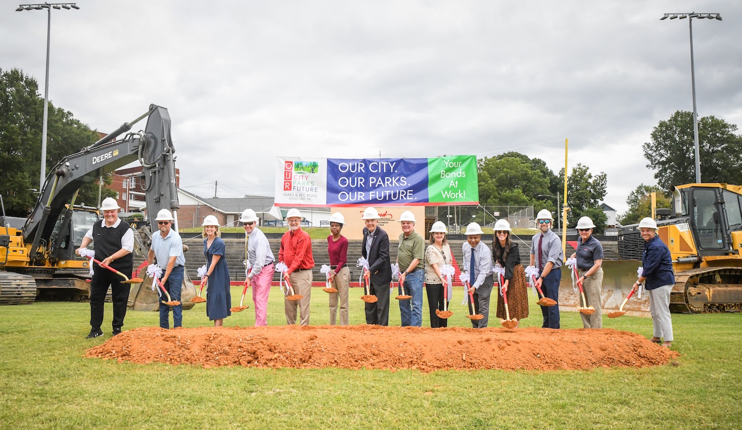 Mayor, City Council, City officials, and Coach EZ Smith join in the ceremonial groundbreaking